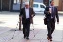 Former executive chairman of defunct JJB Sports Sir David Jones arrives, with his son Stuart, at Leeds Crown Court