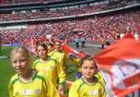 Guiseley AFC Juniors girls parade round at Wembley Stadium before the Community Shield game