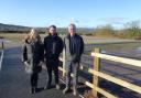 Amy, Richard and Mathew Houldsworth at the site of the proposed visitor centre, the former Bridge End Auction Mart site