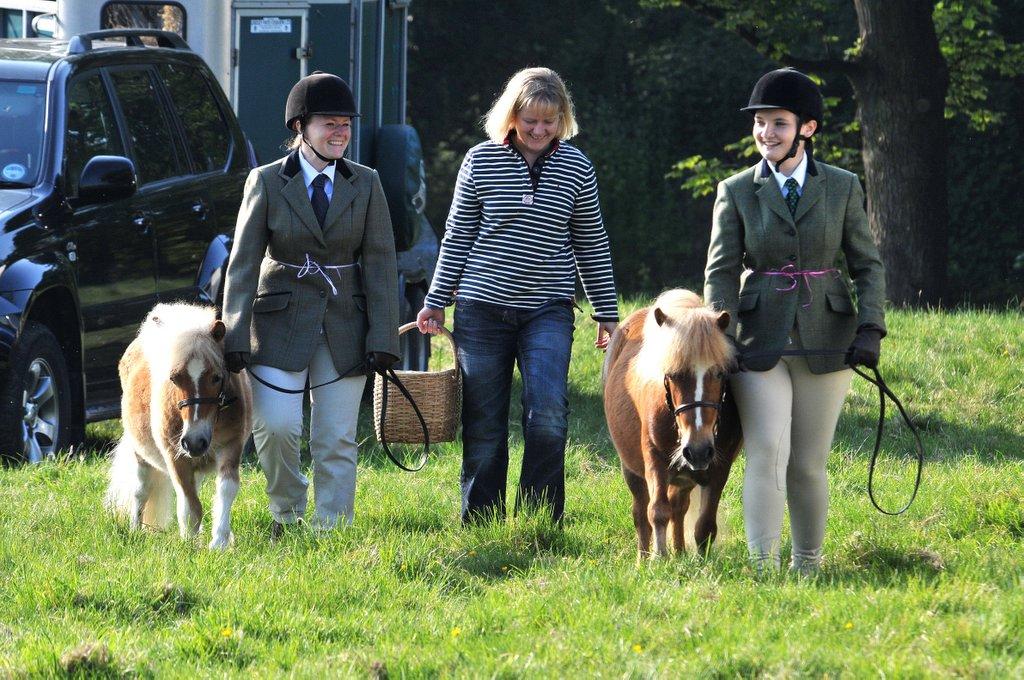 Corinne Milner, Angela Smith and Sammi Tillet make their way to the ring with their Shetland ponies.
