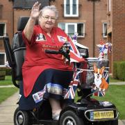 Judith has decorated her mobility scooter with Royal adornments including a corgi. Picture: Mike Simmonds