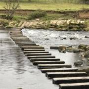 Stepping stones over the River Wharfe in Burley-in-Wharfedale - the location where Burley Bridge Association want to build a bridge