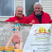 L-R Simon Thomas is greeted by Mike Davies, MBE, at the finish line, Marton Mere Holiday Park, Blackpool