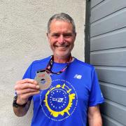 Cllr Ryk Downes with his medal for completing the London Marathon 2023