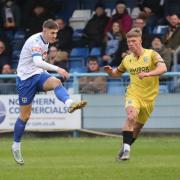 Reece Kendall (white) scored for Guiseley from the spot. Photo: Alex Daniel