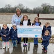Sue Ryder fundraiser Lisa Grimes is receiving the cheque from (left to right) Lola, Myles, Annie, Myla, Aria and Ayda on behalf of the Houldsworth family