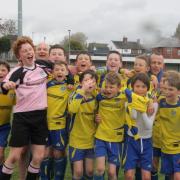 Guiseley Yellows celebrate their Garforth League Challenge Cup final victory