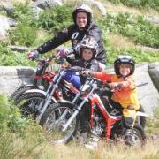 Dougie Lampkin witjh two of the young riders