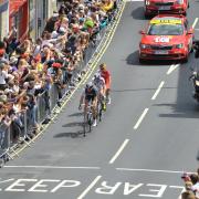 The first riders come through Tour De France in Otley.