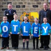 Pupils from Ashfield Primary School celebrating the news, announced in December, that Otley will play a starring role in next year's Tour de Yorkshire, with Sir Gary Verity and Christian Prudhomme. Photography by SWpix.com.