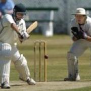 Yeadon wicketkeeper Luke Holroyd watches as Undercliffe's David Taylor attacks
