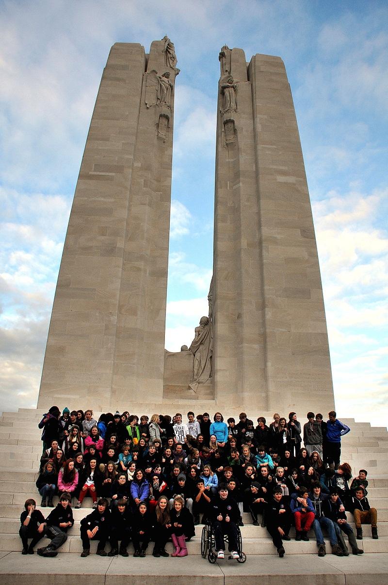 Students gather for a group photo at Vimy Ridge Canadian monument and tunnels