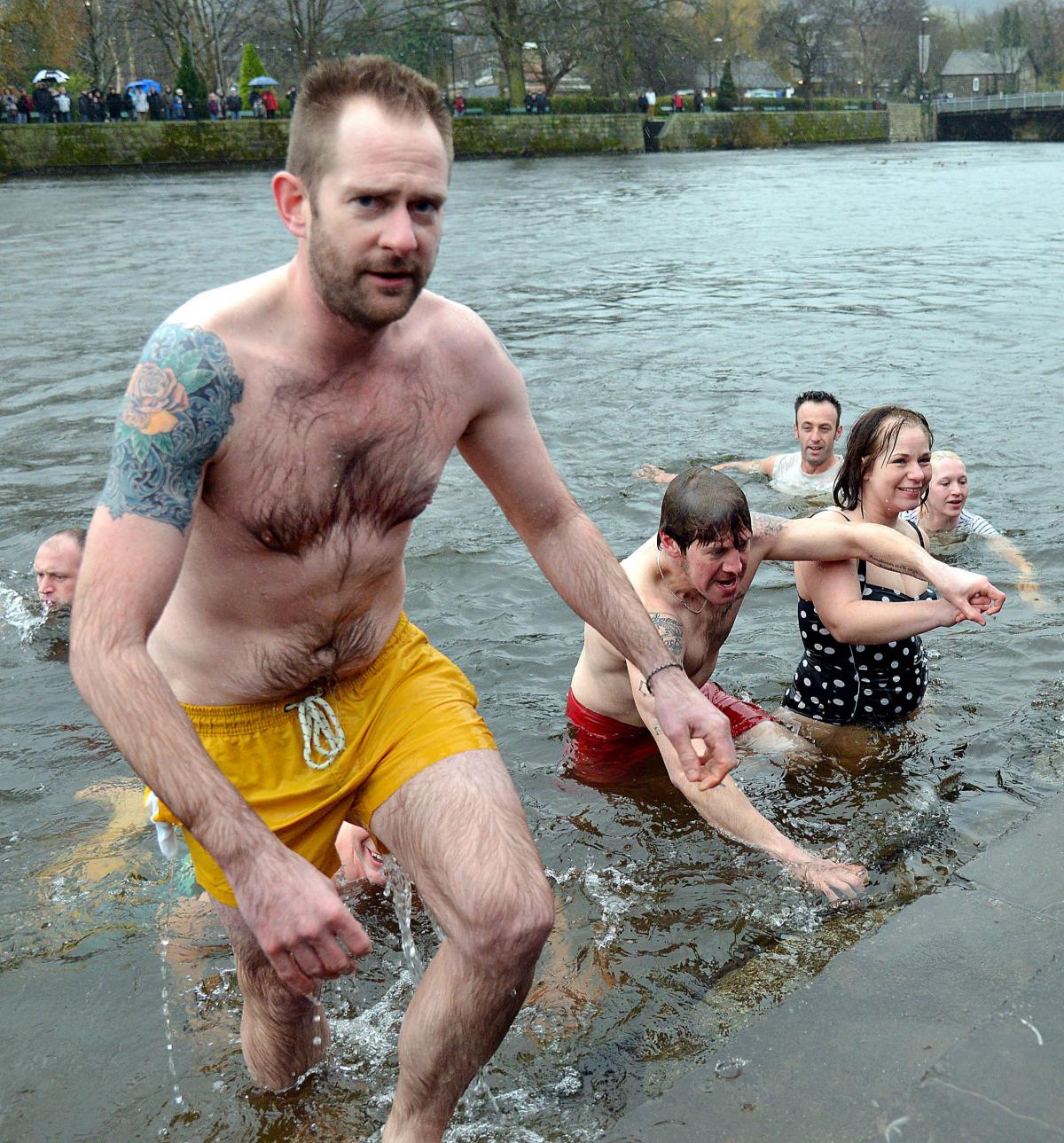 Swimmers leaving the River Wharfe in Otley after the chilly traditional New Year’s Day dip 