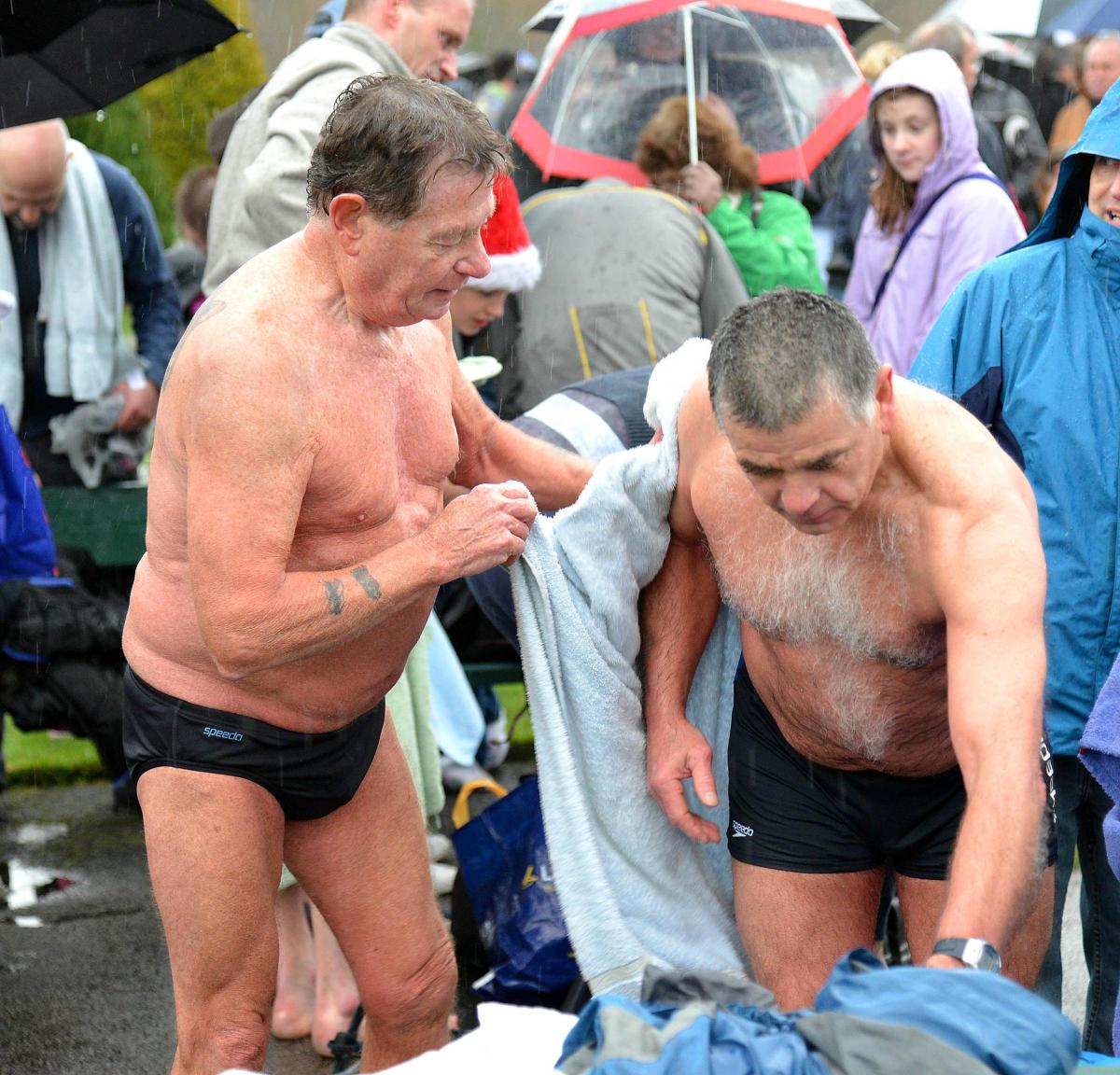 Swimmers get warm after their dip in the Wharfe at Otley on New Year’s Day