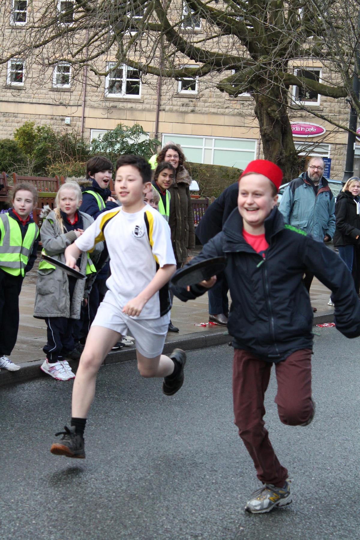 Ilkley Grammary School pupil Fin Tunney, in the red hat, winning the Year 8 race