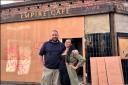 Chef Sam Pullan and his partner Nicole Deighton, outside the cafe premises showing the ‘ghost sign’