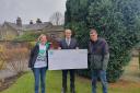 Members of Wildlife Friendly Otley receive the funding from a representative of the Co-op