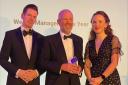 David Loudon, Joint Chief Executive of Redmayne Bentley (centre), accepting the award for Wealth Manager of the Year