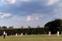 Rawdon Cricket Club in Aire-Wharfe League action last season, with the umpire watching on