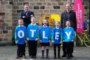 Pupils from Ashfield Primary School celebrating the news, announced in December, that Otley will play a starring role in next year's Tour de Yorkshire, with Sir Gary Verity and Christian Prudhomme. Photography by SWpix.com.