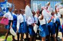 Girls receiving the sanitary kits
