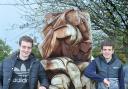 Olympic medallist triathletes Alistair (left) and Jonny Brownlee with a sculpture called Triathlon in their home village of Bramhope