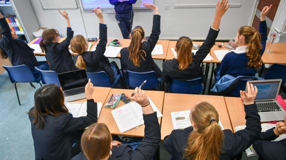 Schools will be asked to teach outdoors if five pupils test positive for Covid