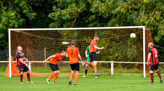 Otley (orange) had to defend for their lives late on, but picked up an outstanding win at Ilkley's seconds, whose side contained plenty of first-teamers. Picture: Andy Garbutt.