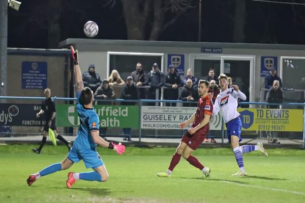 James Gale (right) opening the scoring for Guiseley in their crucial win over Blyth Spartans last night. Picture: Alex Daniel.