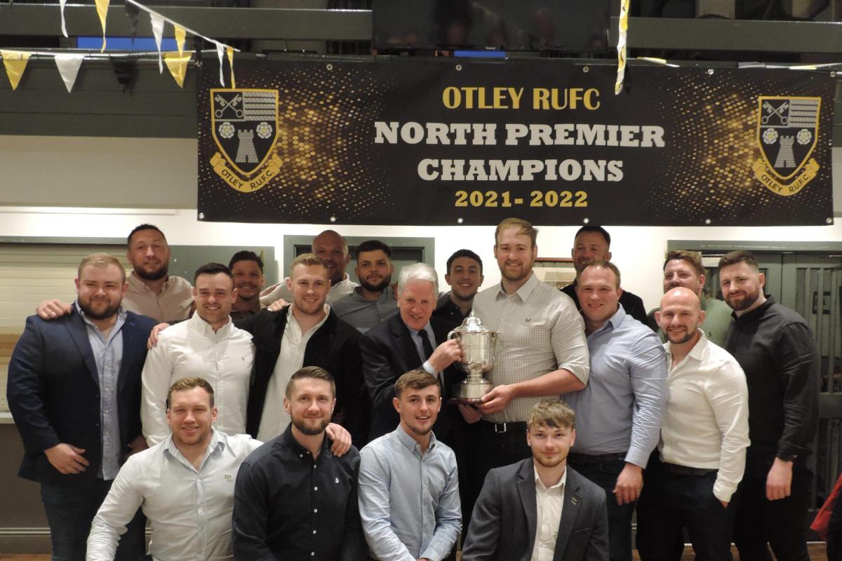 The Otley squad with their league champions trophy