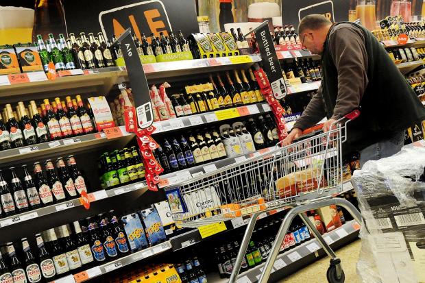 A customer shopping for alcohol