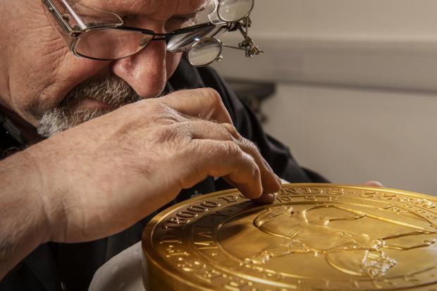 Wharfedale Observer: Master craftsman Steve Dyer works on the 15 kilo gold coin by hand. Credit: The Royal Mint