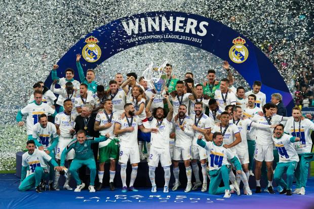 Real Madrid’s Marcelo lifts the trophy as they celebrate winning the Champions League