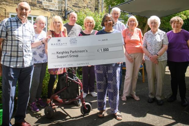 Members of Keighley Parkinson's Support Group with the donation