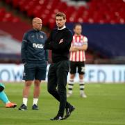 Exeter City manager Matt Taylor (centre) looks dejected after his side's League Two play-off final defeat at Wembley last season Picture: PA