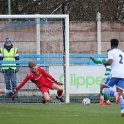 Brad Wade makes a save in Guiseley's draw with Farsley on Boxing Day Picture: Alex Daniel