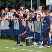 Marcus Bignot (sat down) watches his Guiseley side beat Gloucester City 2-1 last Saturday. Picture: Alex Daniel.