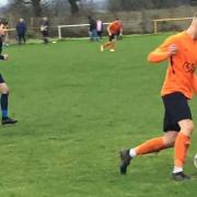 Otley (orange) drive forward in their win at Swillington. Picture: Tricia Duncan.