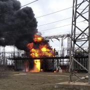In this handout photo provided by Ukraine's Emergency Situation Ministry, flames and smoke rise from the thermal power plant, which, according to local authorities, was damaged by shelling, near the frontline in the town of Shchastia in the Luhansk