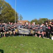 Otley players celebrating after clinching the league title