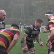 Otley (grey/black) facing off with Harrogate