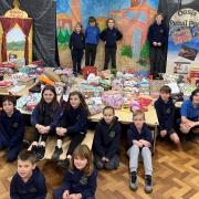 Burley Oaks Primary School pupils with some of the presents they gifted as part of a reverse advent appeal