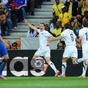 Shane Smeltz (second left) runs off to celebrate scoring for New Zealand against Italy at the 2010 FIFA World Cup. Picture: Adam Davy/PA Images.