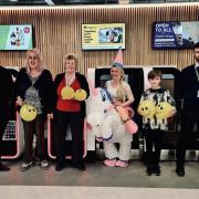 Left to Right; Connor Ivison from Leeds Bradford Airport, Carnival Committee members Nicola and Julia Briggs, Carnival Co-chair Jo Kenyon, Happiness Champion Ewan Law and Team member from Leeds Bradford Airport, Joe Price