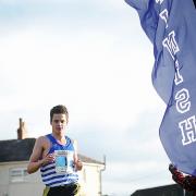 Jonny Brownlee crosses the line to maintain his family's dominance of the Chevin Chase