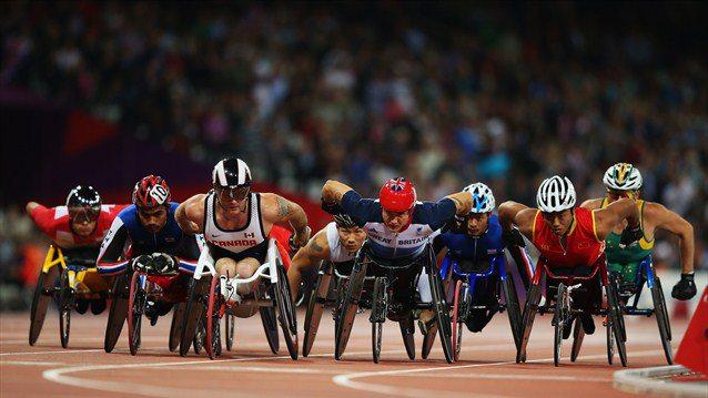 Britain's David Weir, who trains in Richmond Park, leads the field in the men's 1500m — T54 final on his way to gold...