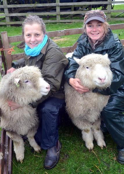 Chevin Forest Wool project founders Flora Harvey and Sharron Lea Smith with two poll Dorsets lambs